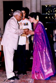 Saroja receiving Padmashri from the president of India.
